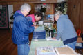 Jeanne Moore, Maureen Kirby, and Nancy Tague study the labels
