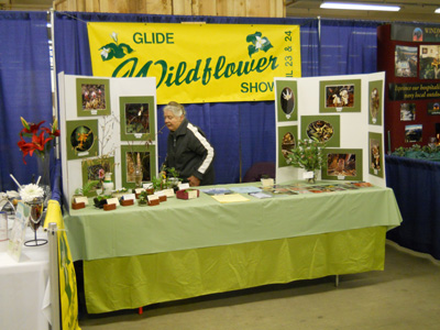 Chairwoman Jeanne Moore prepares the booth